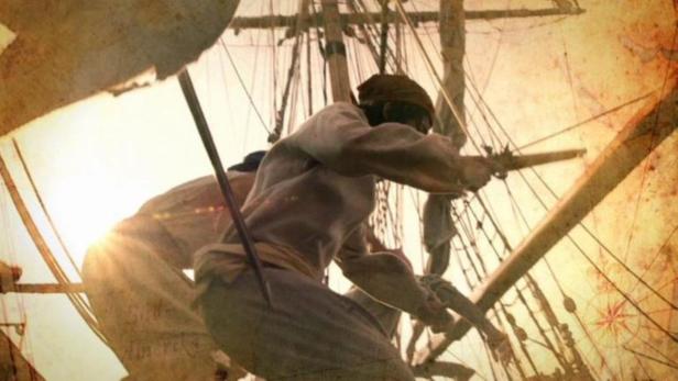 Ein Pirat zielt mit einer Pistole von einem Segelschiff aus.