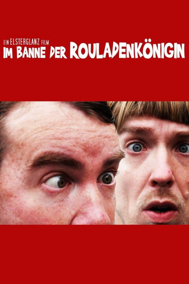 Das Filmplakat für „Im Banne der Rouladenkönigin“ zeigt zwei Männer mit überraschten Gesichtsausdrücken.