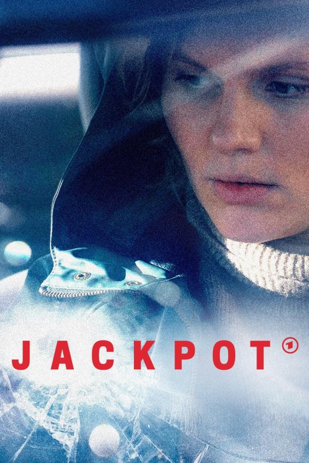 Das Filmplakat für „Jackpot“ zeigt eine Frau im Auto hinter einer zerbrochenen Windschutzscheibe.