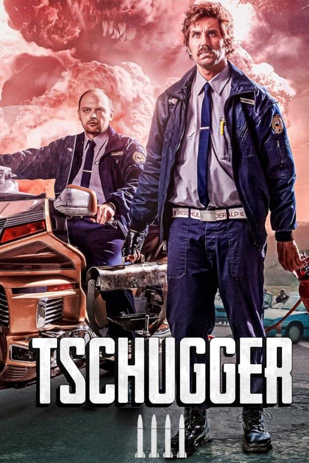 Zwei Polizisten der fiktiven Serie „Tschugger“ posieren vor einer Explosion.