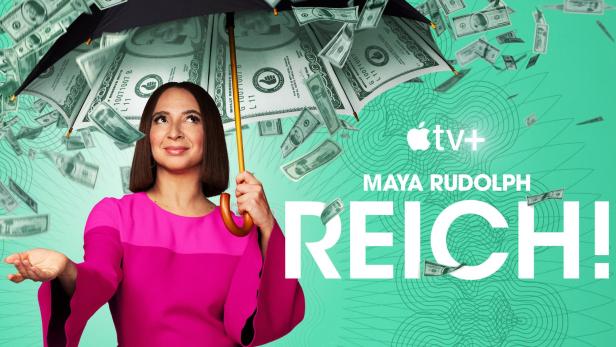 Maya Rudolph unter einem Regenschirm aus Geldscheinen für die Apple TV+ Serie „Reich!“.