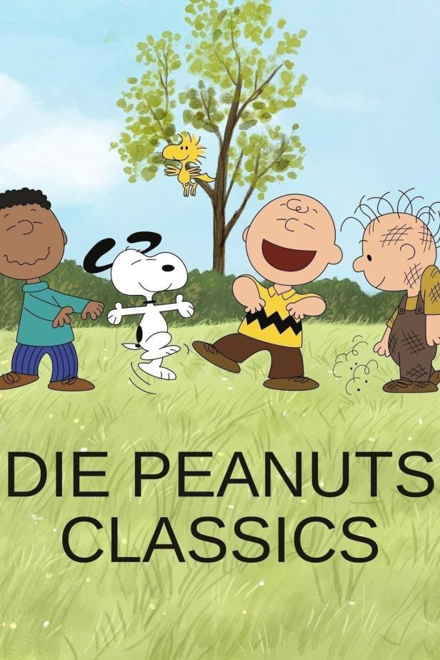 Die Peanuts tanzen mit Woodstock unter einem Baum.