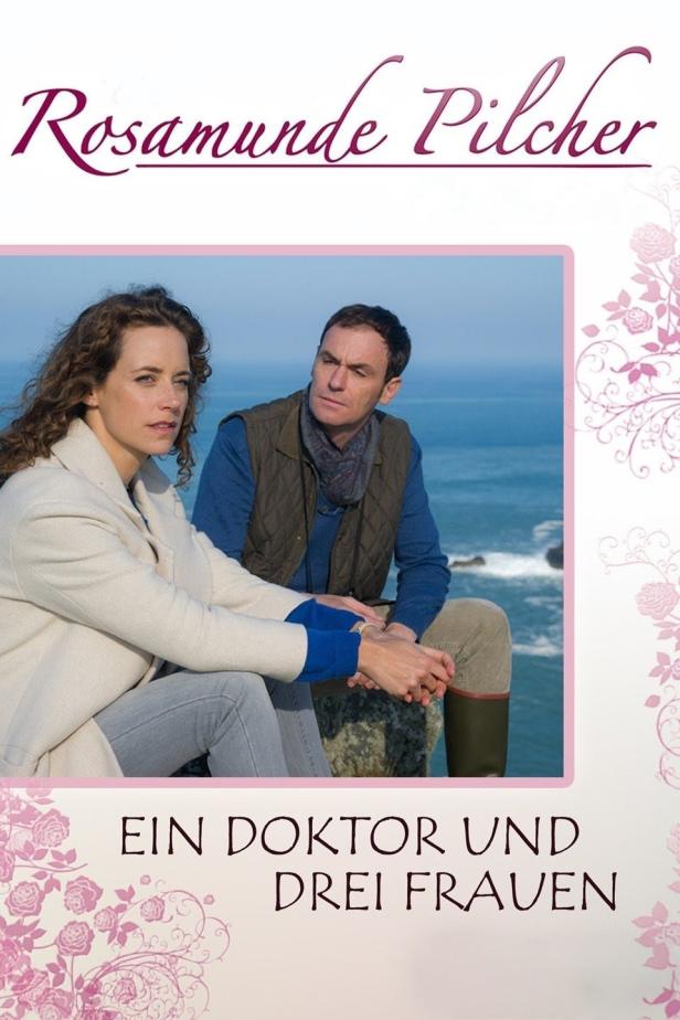 Das Filmplakat zu Rosamunde Pilchers „Ein Doktor und drei Frauen“ zeigt ein Paar an der Küste.