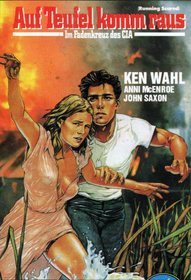 Ein Mann und eine Frau fliehen vor einem Brand im Filmposter zu „Auf Teufel komm raus“.