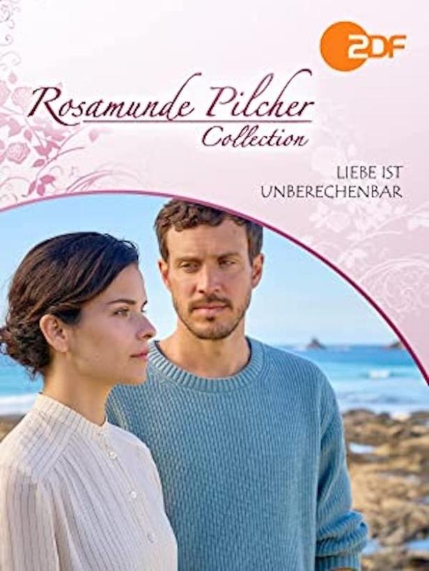 Das Cover der Rosamunde Pilcher Collection: „Liebe ist unberechenbar“ mit zwei Personen vor einer Küstenlandschaft.