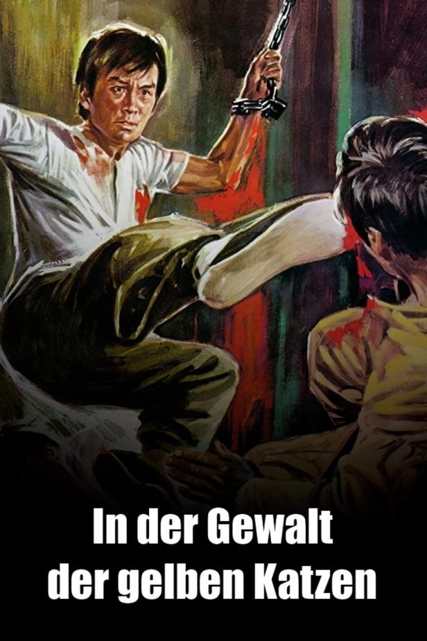 Ein Mann mit einer Kette in der Hand tritt einen anderen Mann, beide sind mit Blut bedeckt.