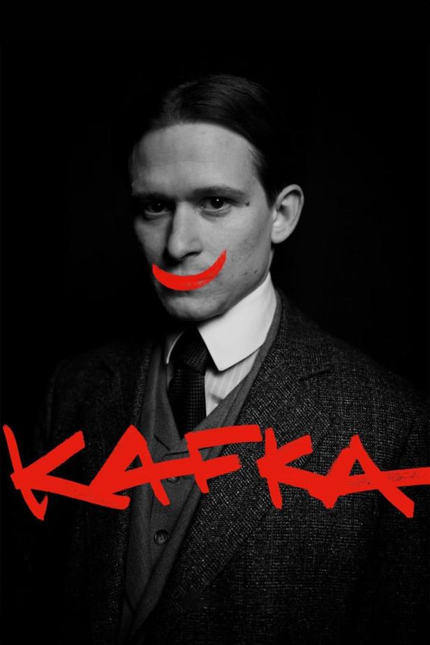 Ein Porträt von Franz Kafka mit einem aufgemalten roten Grinsen und dem Schriftzug „Kafka“.