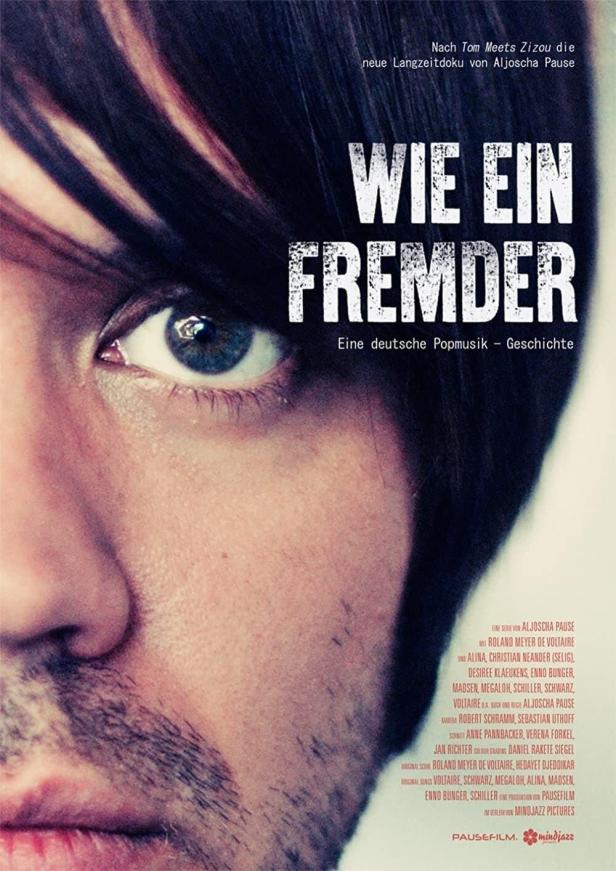 Das Filmplakat für „Wie ein Fremder“ zeigt das Gesicht eines Mannes im Halbdunkel.