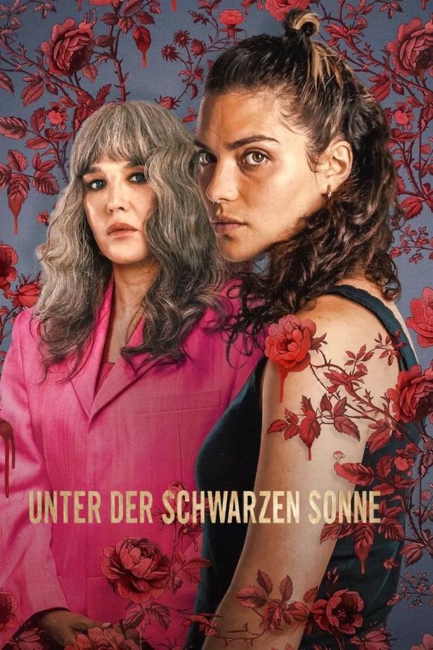 Das Filmplakat für „Unter der schwarzen Sonne“ zeigt zwei Frauen vor einem floralen Hintergrund.