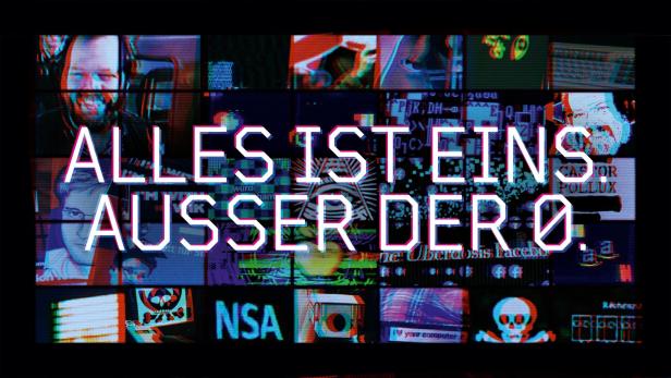 Ein Bildschirm zeigt den Schriftzug „Alles ist eins, außer der 0“ und verschiedene digitale Elemente.
