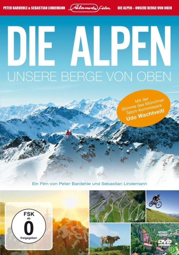 Das Filmplakat für „Die Alpen – Unsere Berge von oben“ zeigt schneebedeckte Berggipfel.
