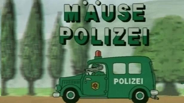 Szene aus der Zeichentrickserie „Mäusepolizei“ mit einer Maus in einem grünen Polizeiauto.