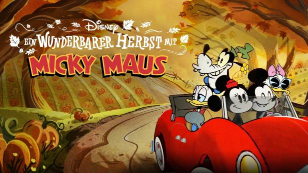 Micky Maus, Goofy, Donald Duck und Daisy Duck fahren in einem roten Auto durch eine Kürbisplantage.