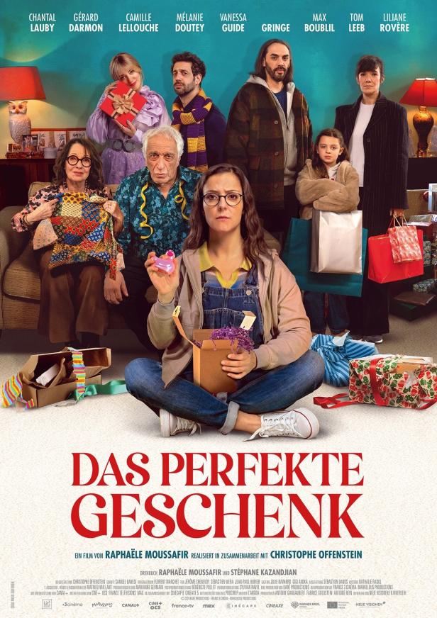 Das Filmplakat für „Das perfekte Geschenk“ zeigt eine Frau mit einem Geschenk, umgeben von ihrer Familie.