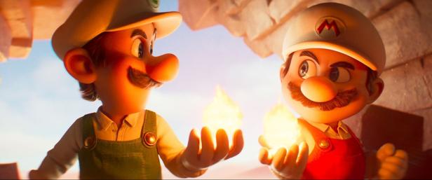Super Mario und Luigi halten leuchtenen Kugeln in den Händen
