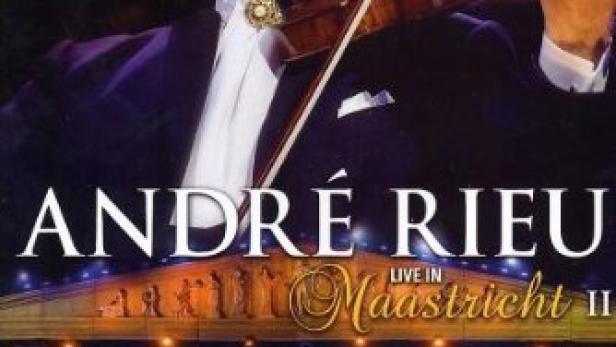 Das Cover von André Rieus „Live in Maastricht II“ mit dem Musiker, der Geige spielt, vor einem Orchester.
