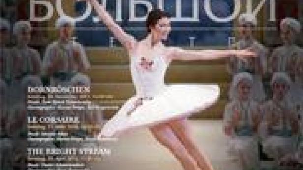 Eine Ballerina tanzt vor dem Bolschoi-Ballett auf einem Werbeplakat.