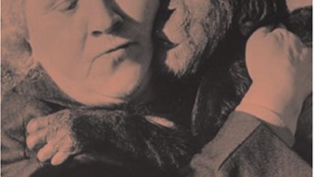 Das Filmplakat für „Land des Schweigens und der Dunkelheit“ von Werner Herzog zeigt eine Frau mit einem Schimpansen.