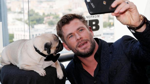 Chris Hemsworth poses for a picture during a photocall for the film "Men in Black: International" in Moscow