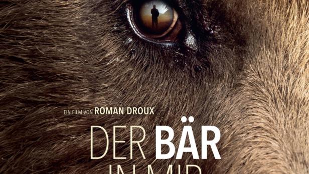 Das Filmplakat für „Der Bär in mir“ zeigt das Auge eines Bären, in dem eine menschliche Silhouette zu sehen ist.