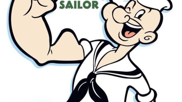 Die Zeichentrickfigur Popeye der Seemann zeigt seinen Bizeps.