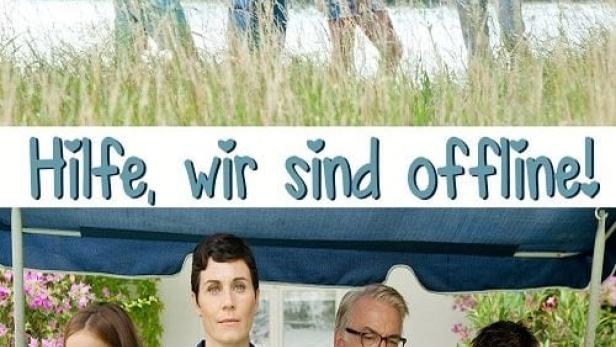 Eine Familie, die in zwei Gruppen geteilt ist, nutzt ihre Smartphones, während sie eigentlich die Natur genießen sollten.