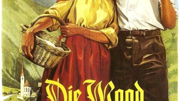 Das Filmplakat für „Die Magd von Heiligenblut“ zeigt Alice Graf und Erich Auer in Tracht vor einer Bergkulisse.