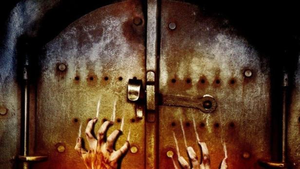 Das Filmplakat für „Hänsel und Gretel“ zeigt Hände, die aus einem Ofen greifen.