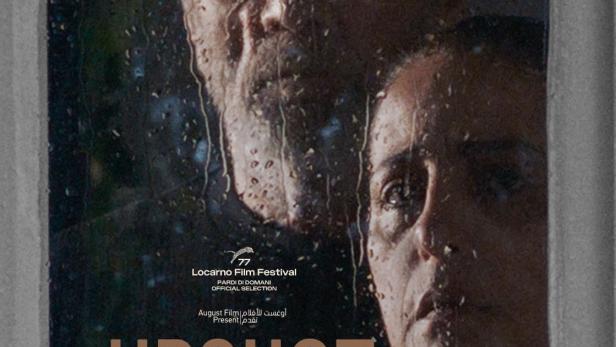 Das Filmplakat für „Upshot“ zeigt zwei Gesichter hinter einer verregneten Fensterscheibe.