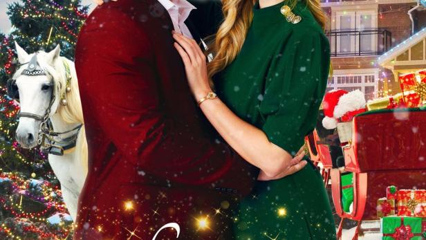 Das Filmplakat für „Loving Christmas“ zeigt Brittany Bristow und Olivier Renaud vor weihnachtlicher Kulisse.