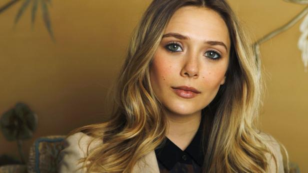 File photo of actress Elizabeth Olsen posing for a