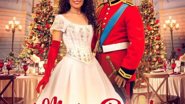 Das Filmplakat für „A Merry Royal Christmas“ zeigt Kathryn Davis und Riley Neldam in festlicher königlicher Umgebung.