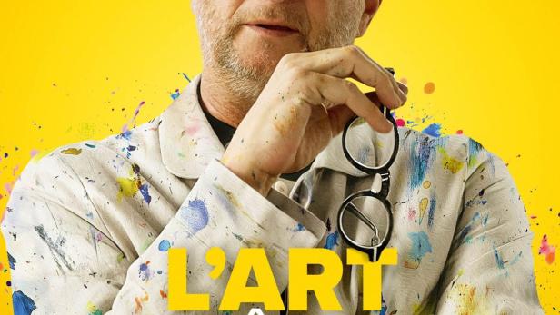 Das Filmplakat zeigt Benoit Poelvoorde als Künstler mit Farbflecken auf seiner Kleidung, der seine Brille hält.