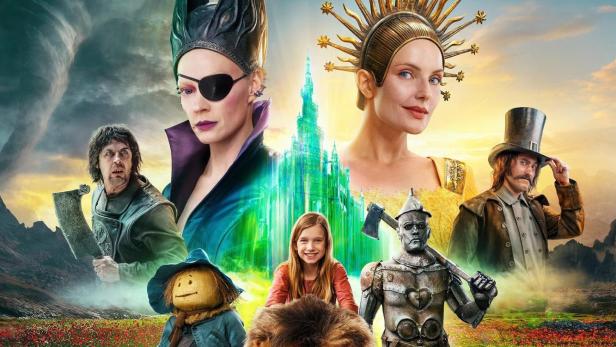 Das Filmplakat für „Der Zauberer der Smaragdenstadt“ zeigt die Charaktere auf der gelben Backsteinstraße.