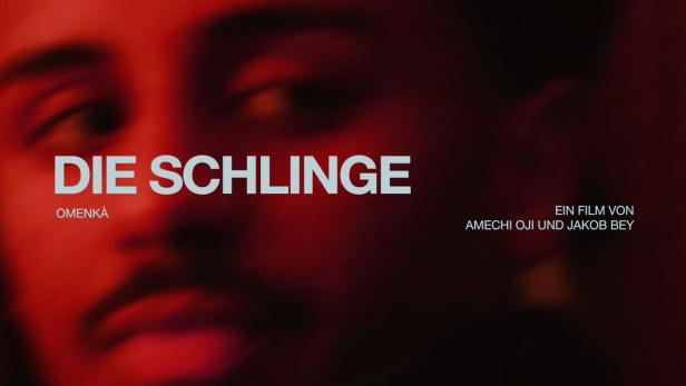 Das Filmplakat für „Die Schlinge“ zeigt das Gesicht eines Mannes im roten Licht.