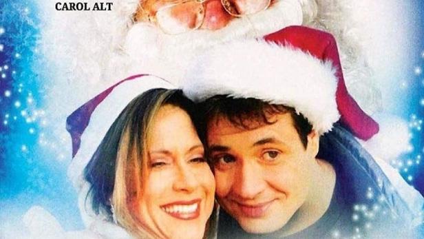 Das Filmplakat für „Die Stadt, die Weihnachten verbannte“ zeigt den Weihnachtsmann und zwei Schauspieler.