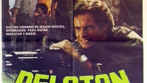 Das Filmplakat für „Peloton Salvaje“ zeigt Antonio Sabato mit einem Maschinengewehr vor einer explosiven Kriegsszene.