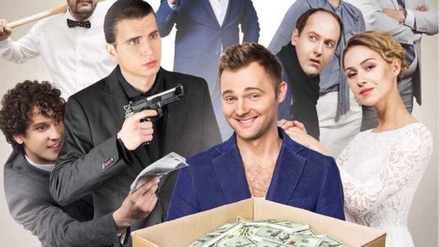 Das Filmplakat für die russische Komödie „Sotka“ zeigt eine Gruppe von Schauspielern um eine Kiste voller Geld.