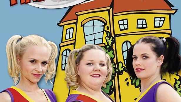 Das DVD-Cover der ersten Staffel von „Böse Mädchen“ zeigt drei Cheerleader vor einem gelben Haus.