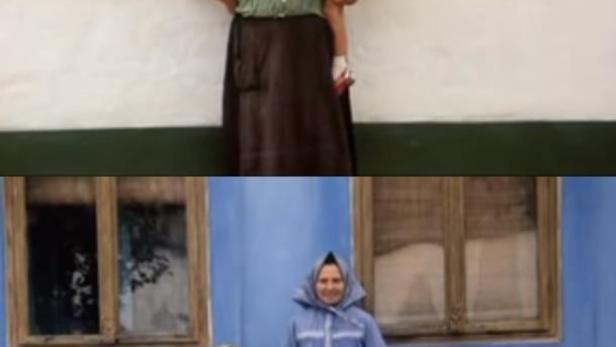 Zwei Frauen und zwei Mädchen in traditioneller Kleidung vor Häusern.