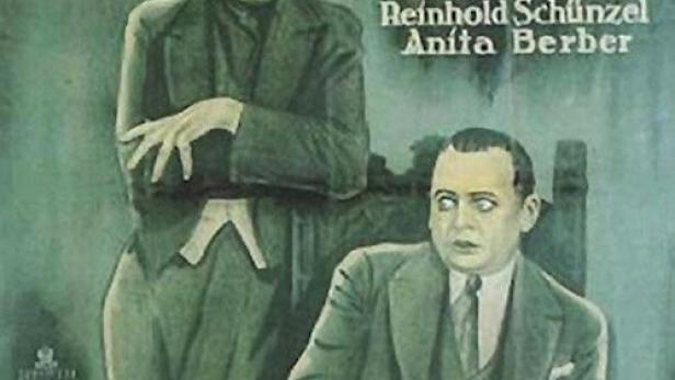 Das Filmplakat für „Grausige Nächte“ zeigt Conrad Veidt und Reinhold Schünzel vor einer Uhr.