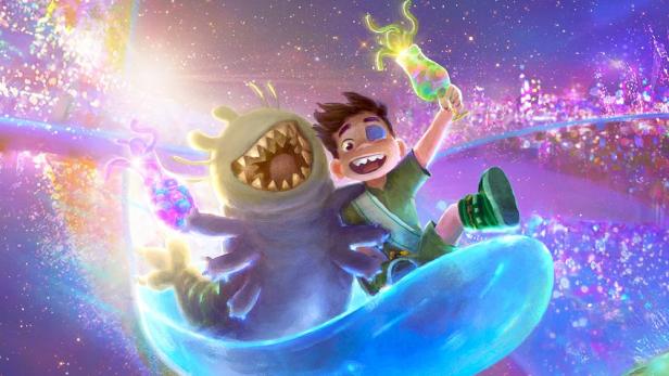 Ein Junge und ein freundliches Monster reiten auf einer blauen Welle vor einem Publikum.