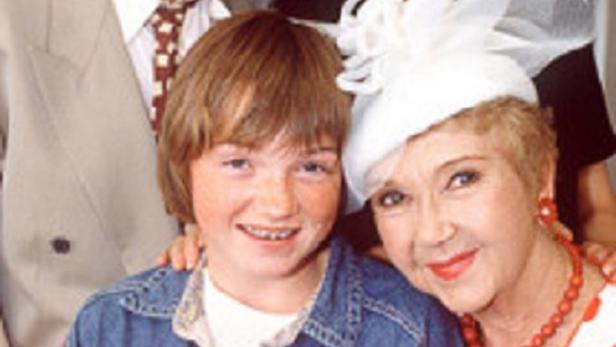 Das Filmplakat für „Wenn das die Nachbarn wüssten“ zeigt vier Schauspieler.