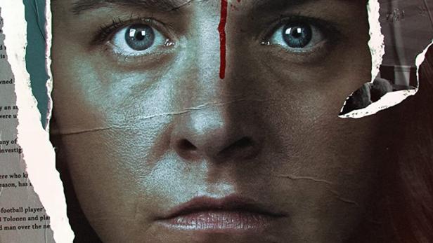 Das Filmplakat für „Kansan Vihollinen“ zeigt das Gesicht einer Frau mit einem roten Fleck auf der Stirn.