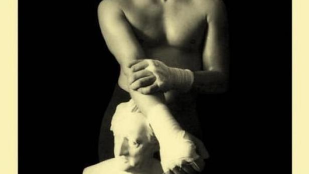 Ein Filmposter für „Der Boxprinz“ mit einem Boxer und einer Büste.