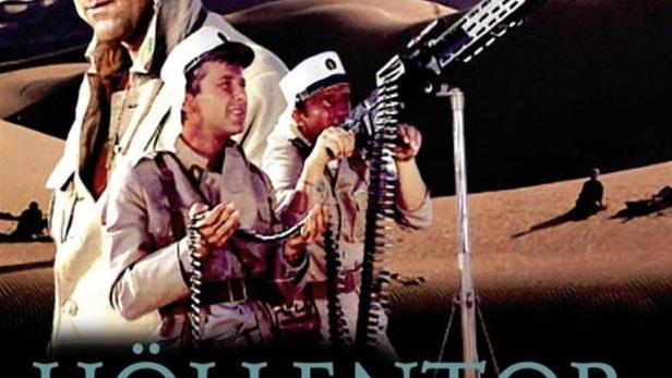 Das Filmplakat für „Höllentor Sahara 1943“ zeigt Soldaten in der Wüste mit einem Maschinengewehr.