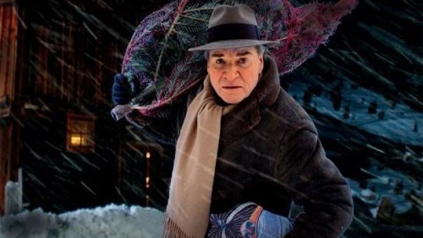Das Filmplakat zu „Das Weihnachts-Ekel“ zeigt Fritz Wepper mit einem Weihnachtsbaum im Schnee.