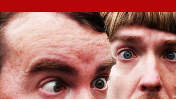 Das Filmplakat für „Im Banne der Rouladenkönigin“ zeigt zwei Männer mit überraschten Gesichtsausdrücken.