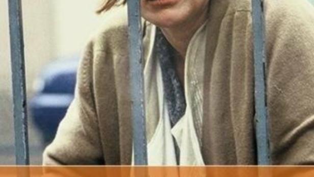 Das Filmplakat für „Dunkle Tage“ zeigt eine Frau hinter Gittern.