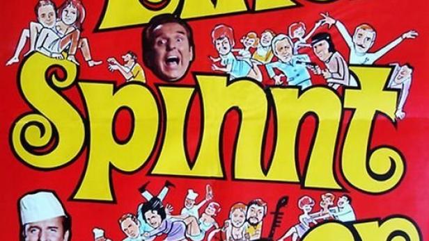 Das Filmplakat für „Einer spinnt immer“ mit Georg Thomalla und vielen Comicfiguren.